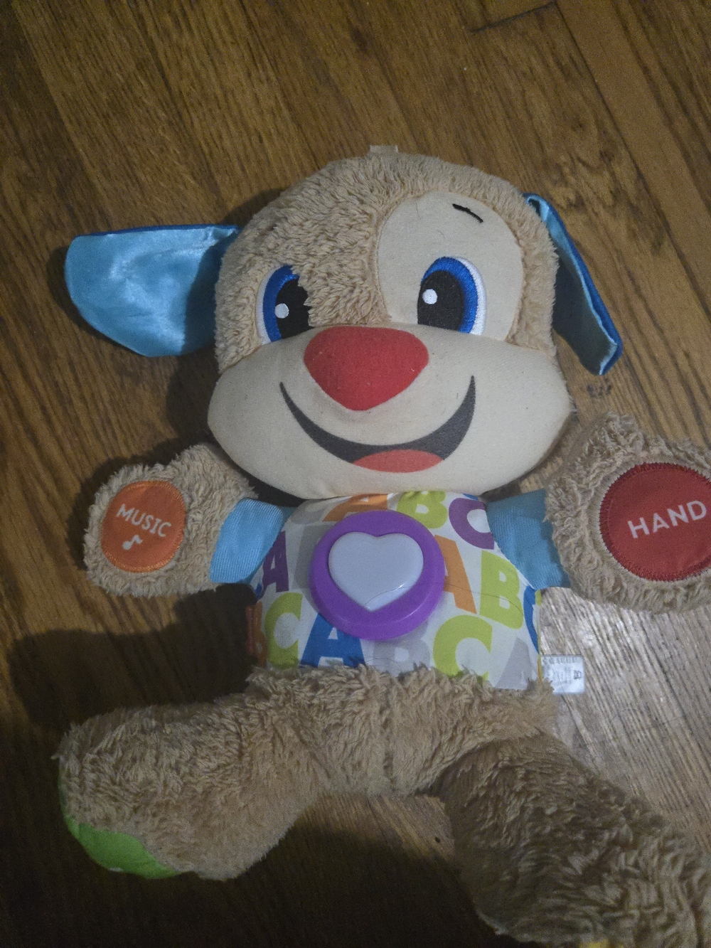 Plush Learning Puppy Toy in Tan with Blue Accents